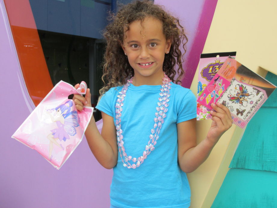 child with fairy loot bag